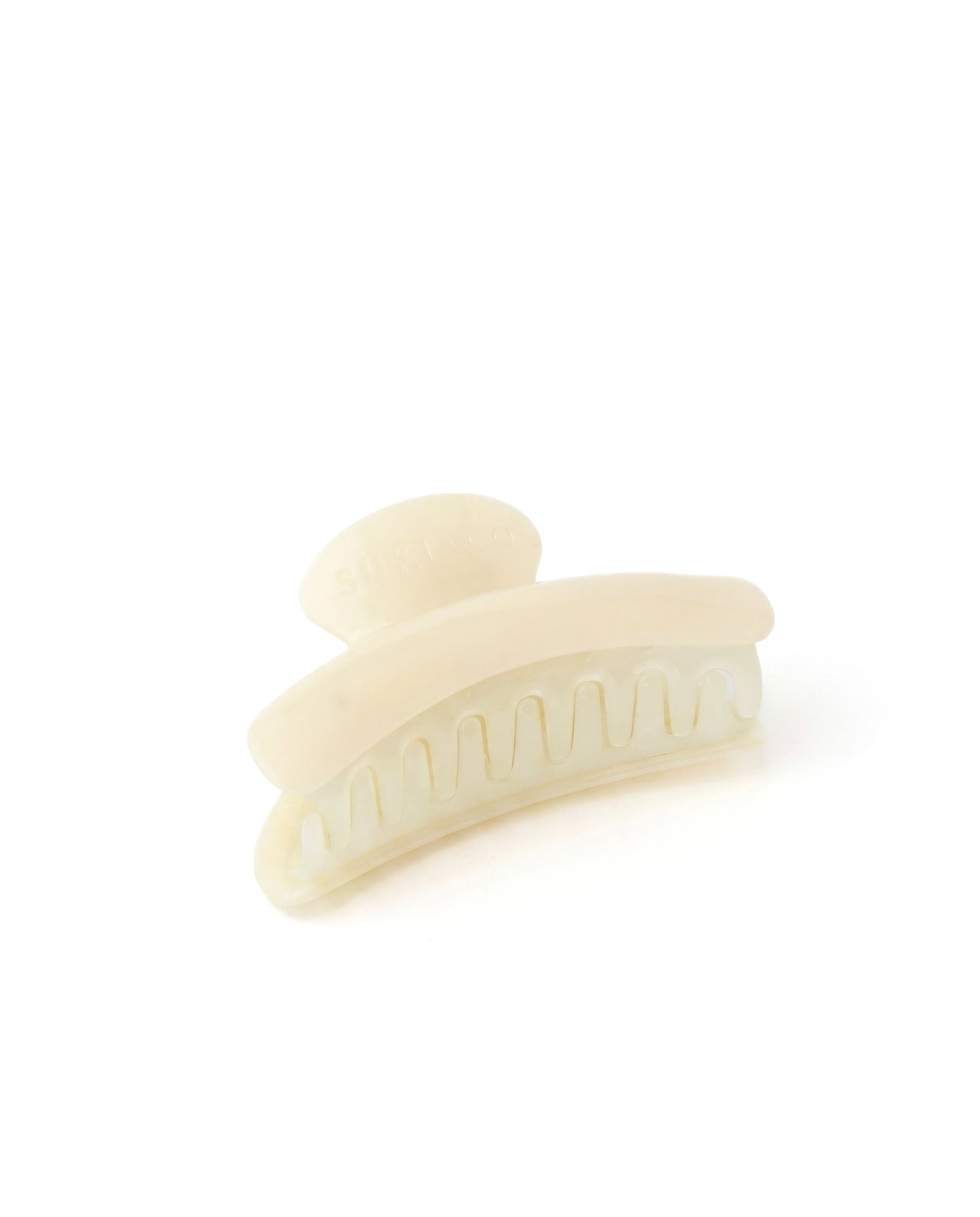 Beige hair clip on a white background